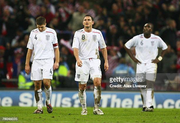 Steven Gerrard, Frank Lampard and Sol Campbell of England look dejected after the Euro 2008 Group E qualifying match between England and Croatia at...