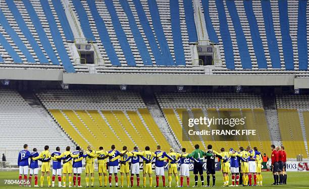 France's team and Ukraine's team pose during their Euro 2008 qualifying football match Ukraine vs. France. France is already qualified after Italy's...