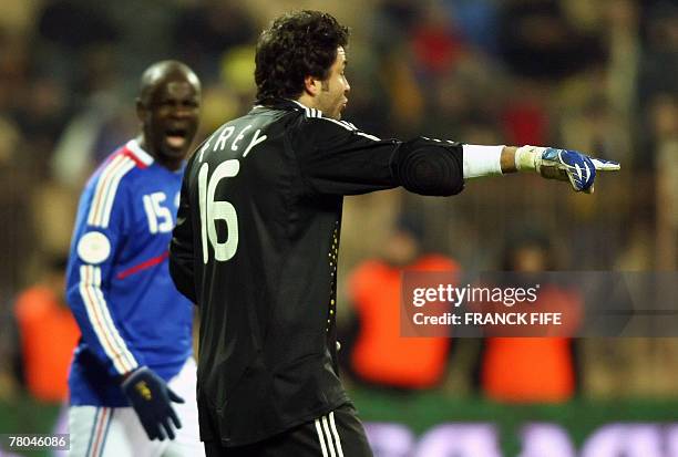 France's goalkeaper Sebatien Frey talks with captain Lilian Thuram during their Euro 2008 qualifying football match Ukraine vs. France. France is...