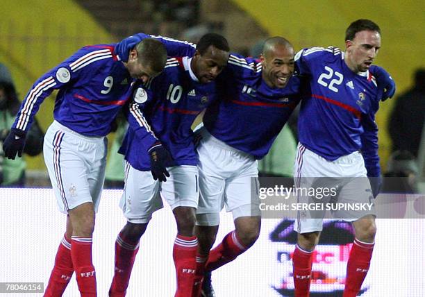 Players of France's national team react after they scored during their Euro 2008 qualifying football match Ukraine vs. France, 21 November 2007 at...