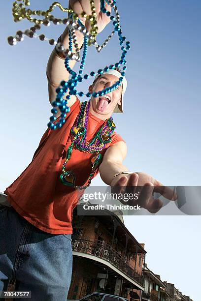 man celebrating mardi gras - bead necklace stock pictures, royalty-free photos & images