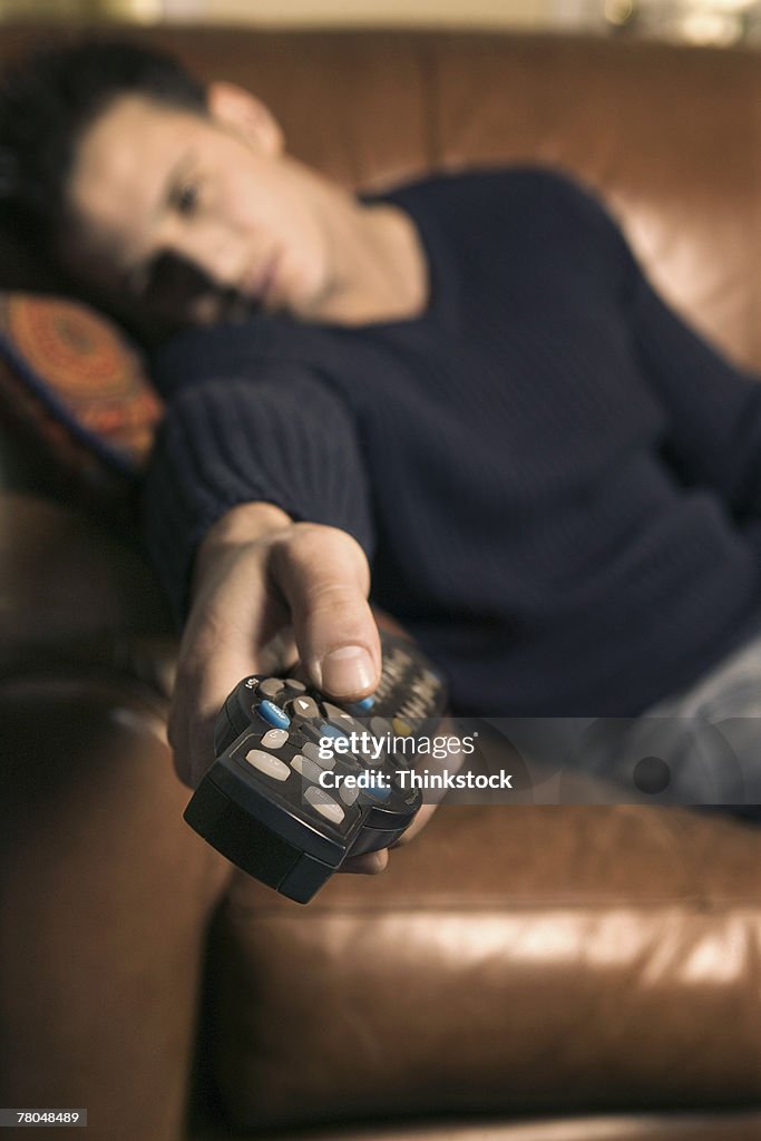 Man lounging with a remote control