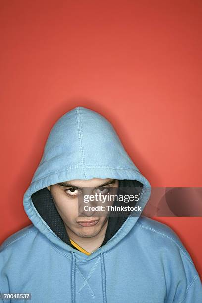 man in a hooded jacket - c100 stock pictures, royalty-free photos & images