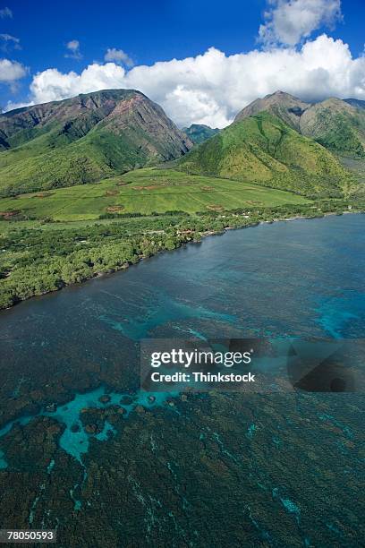 Aerial View Of Hawaiian Coastline With Mountains High-Res Stock Photo
