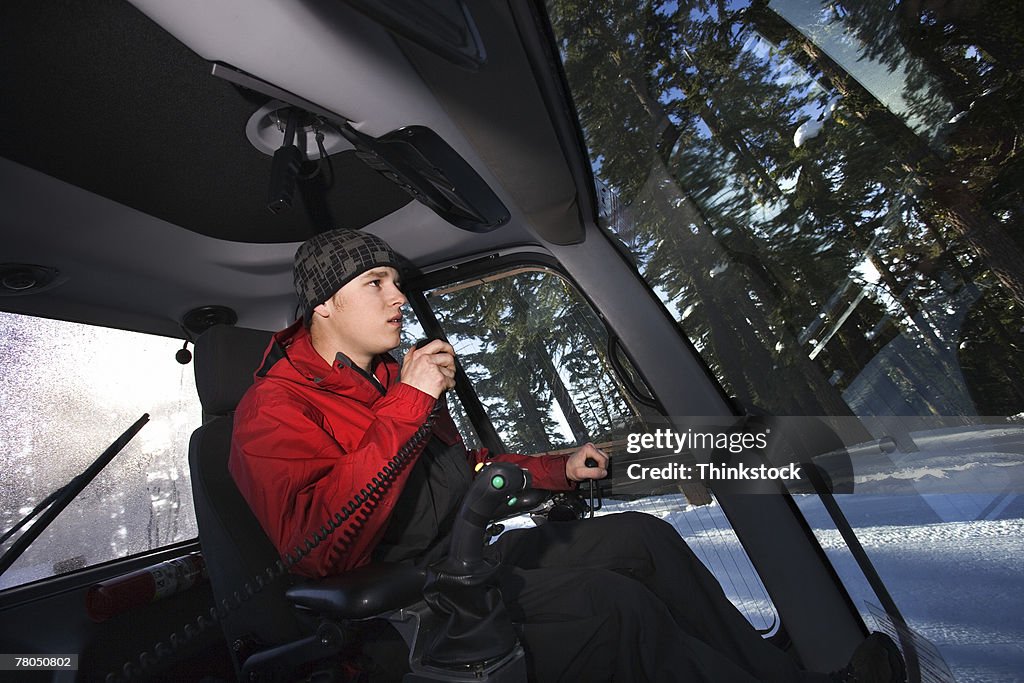Man driving snow plow