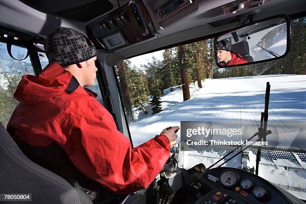 man driving snow plow - snowplow stock-fotos und bilder