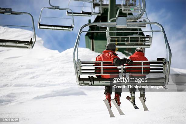 couple on ski lift at lake tahoe - ski lift stock pictures, royalty-free photos & images