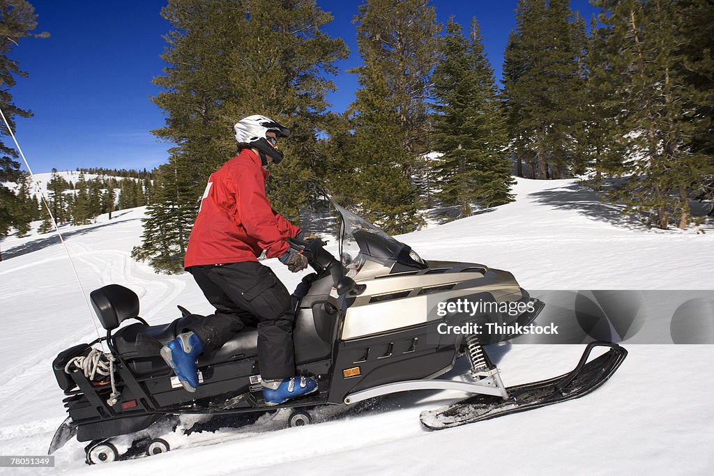 Ski patrol on snowmobile
