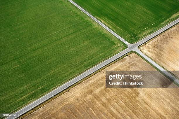 aerial view of rural roads intersecting - crossroad stock pictures, royalty-free photos & images