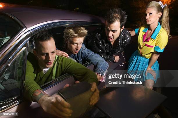 friends at retro drive-in restaurant - angry waitress stock pictures, royalty-free photos & images