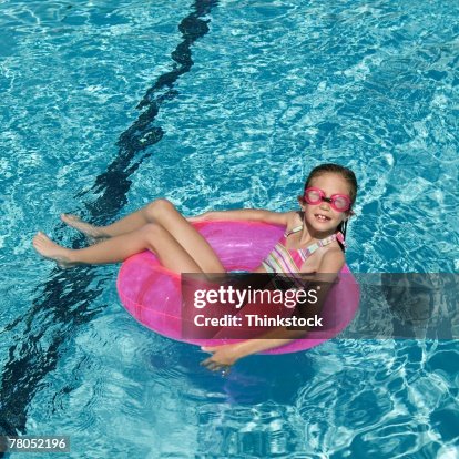 Tween Floating Inpool Girl Floating In Swimming Pool High-Res Stock Photo - Getty Images