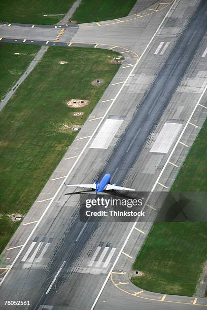 aerial view of plane taking off at john wayne airport, irvine, california - john wayne airport stock pictures, royalty-free photos & images
