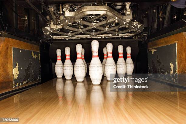 bowling pins and machine - bowling pin stock pictures, royalty-free photos & images