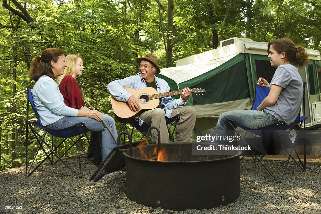 Family around campfire