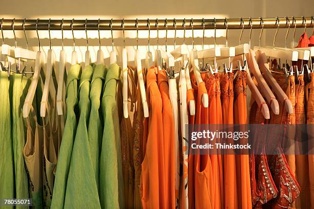 clothing on rack - color coordinated stock pictures, royalty-free photos & images