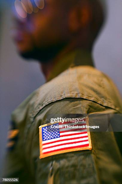 american flag badge on shoulder - us military emblems photos et images de collection