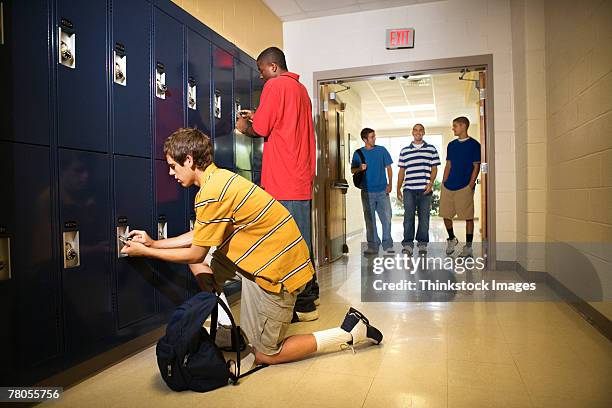 teenage boys in school hallway - safe lock stock pictures, royalty-free photos & images