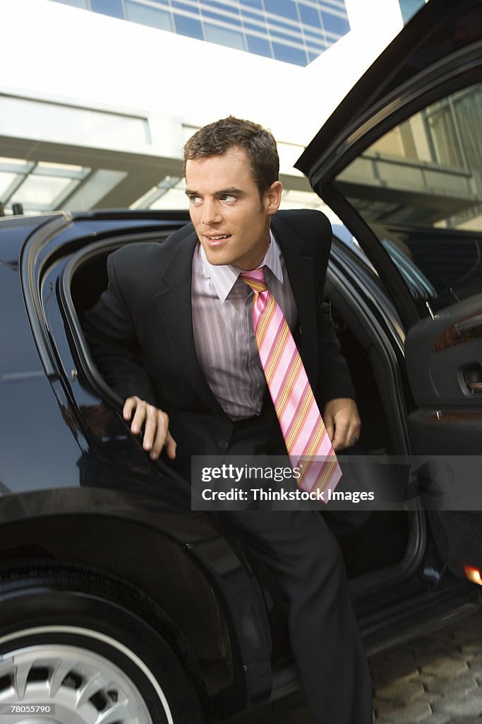 Man getting out of limousine