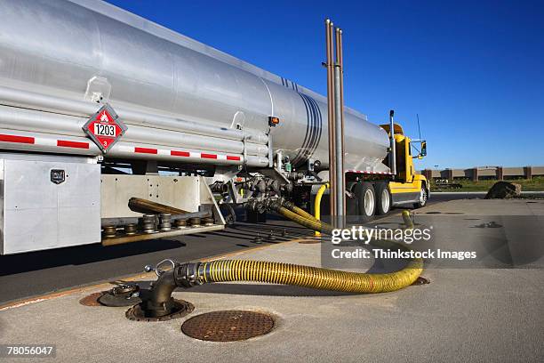 semi-truck at gas station - tanklastwagen stock-fotos und bilder