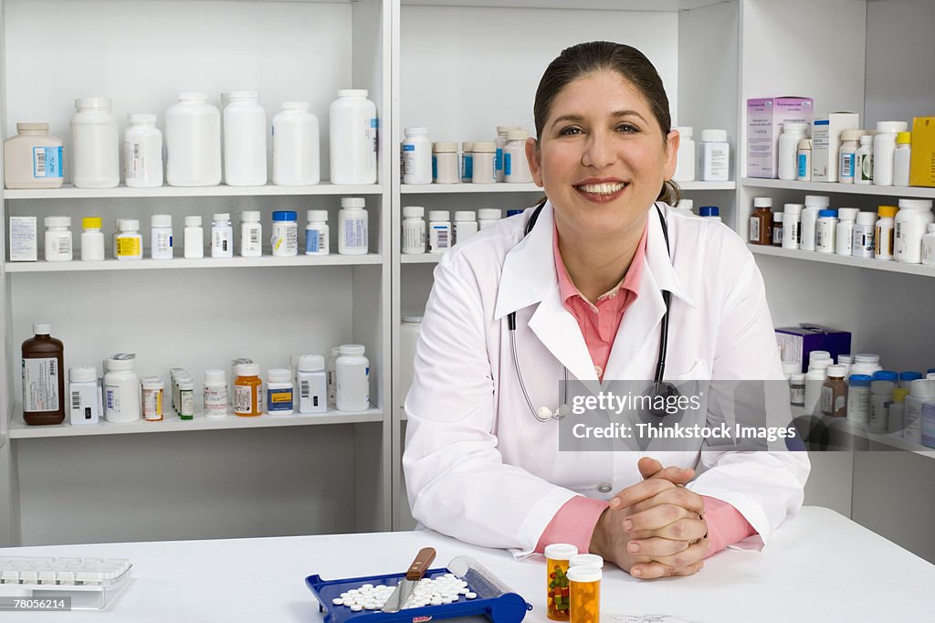 Pharmacist with pill bottles