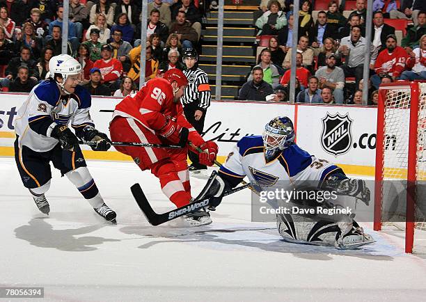 Tomas Holmstrom of the Detroit Red Wings takse a shot on Manny Lagace of the St Louis Blues during an NHL game on November 21, 2007 at Joe Louis...