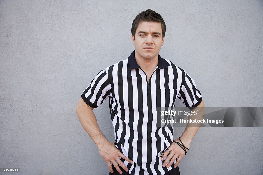 Referee with hands on hips