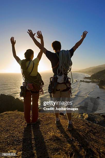 rock climbers on pinnacle - oceanas coastal voices summit stock pictures, royalty-free photos & images