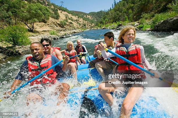 people whitewater rafting - white water rafting stock pictures, royalty-free photos & images