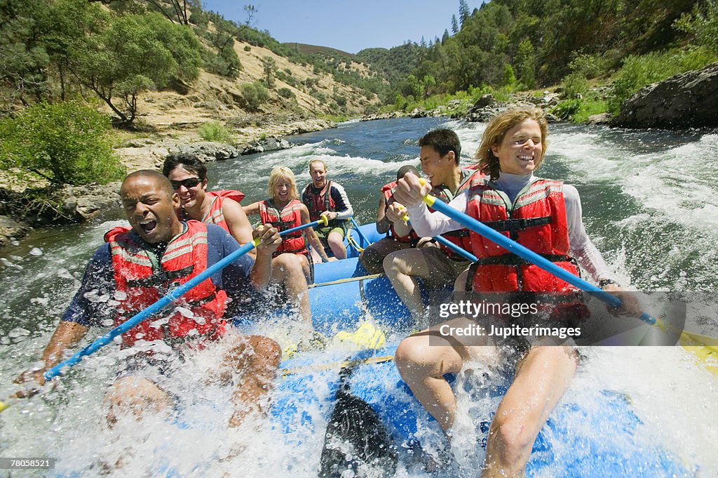 People whitewater rafting