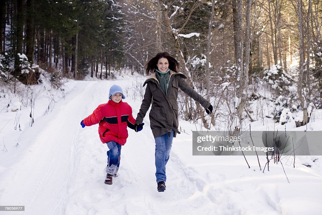 Mother and son in snow