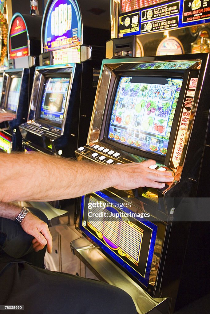 Person playing slot machine