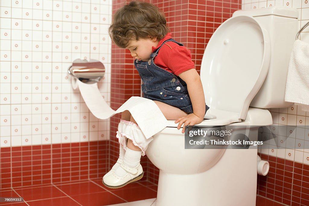 Girl using toilet