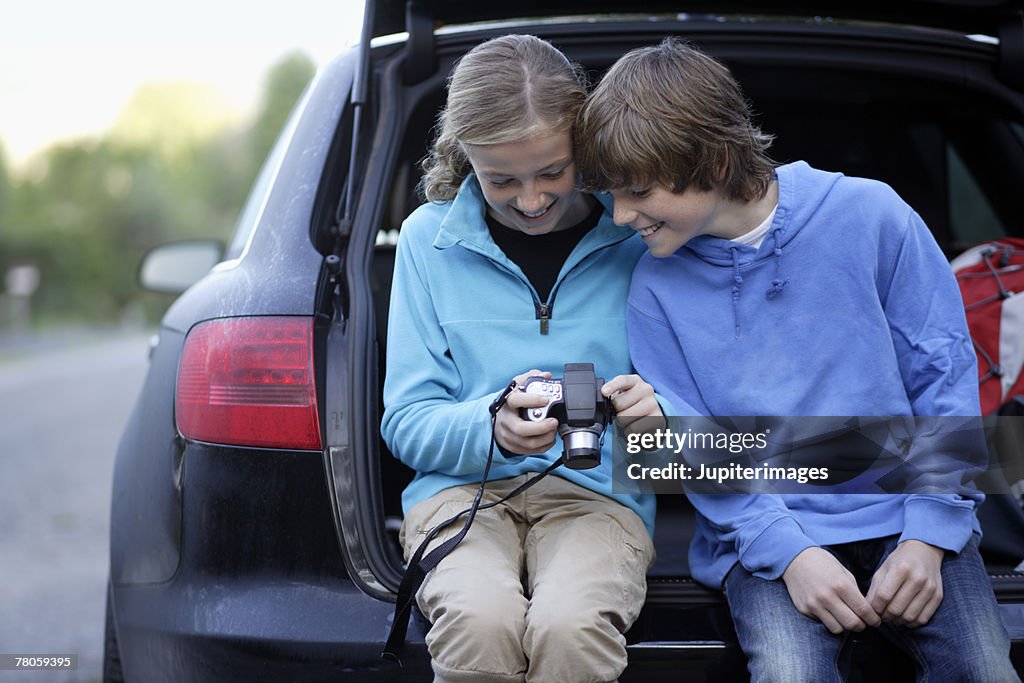 Boy and girl with camera