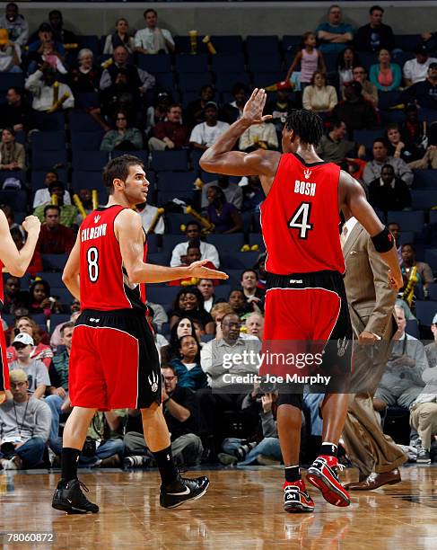 Chris Bosh and Jose Calderon of the Toronto Raptors celebrate their win over the Memphis Grizzlies on November 21, 2007 at the FedExForum in Memphis,...