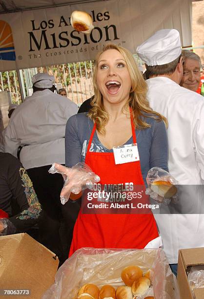 Actress Alana Curry participates in serving Thanksgiving dinner to the Skid Row homeless hosted by Kirk and Anne Douglas at the Los Angeles Mission...