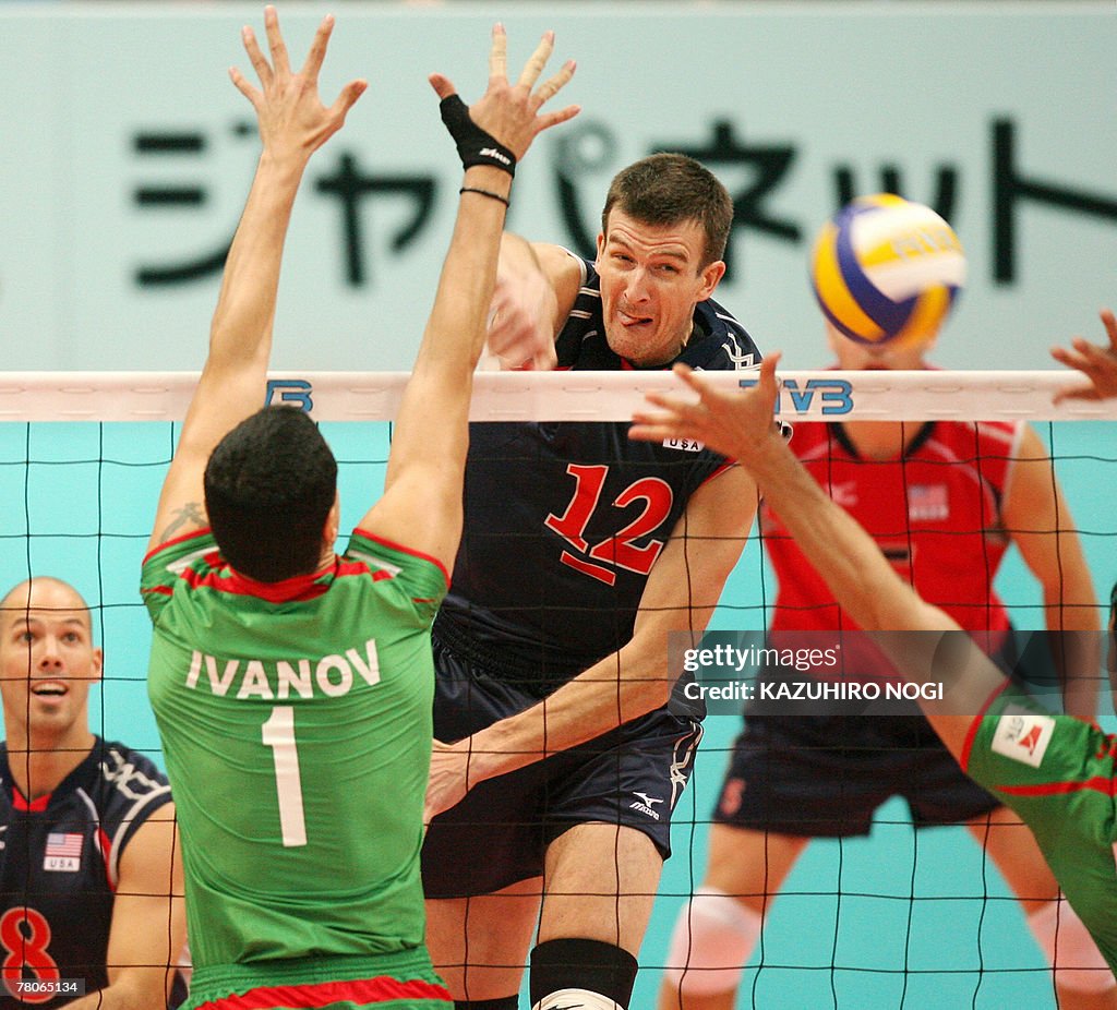 US volleyball team captain Thomas Hoff smashes the ball past... News