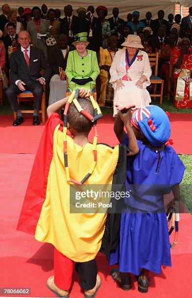 Prince Philip, The Duke of Edinburgh and HRH Queen Elizabeth II watch AIDS orphans perform a fashion show at the Mildmay centre for AIDS Orphans on...