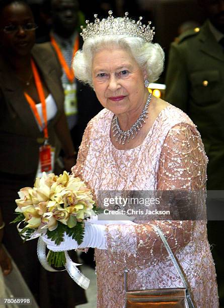 Queen Elizabeth II smiles as she arrives for a State Banquet at State House on November 22, 2007 in Entebbe, Uganda. The Queen will open the...