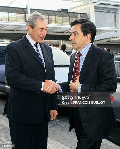 French Prime minister Francois Fillon is welcomed by Jacques Pelissard, president of the France's mayors Association , before attending the 90th AMF...