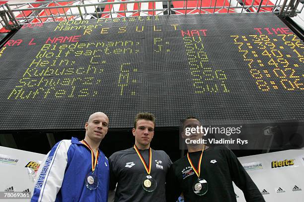 Jan Wolfgarten of SV Wuerzburg finishing second, Paul Biedermann of SV Halle finishing first and Christian Hein of SG EWR Rheinhessen-Mainz finishing...