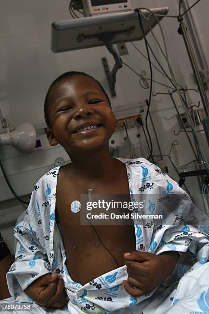 Michael Otsinwa, a five-year old Christian boy from Lagos in Nigeria, proudly shows off his scars as he recovers from his corrective heart surgery...