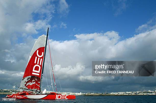 French skipper Francis Joyon steers his maxi trimaran IDEC, 23 November 2007, off Brest western France, at the start of his solitary round-the-world...