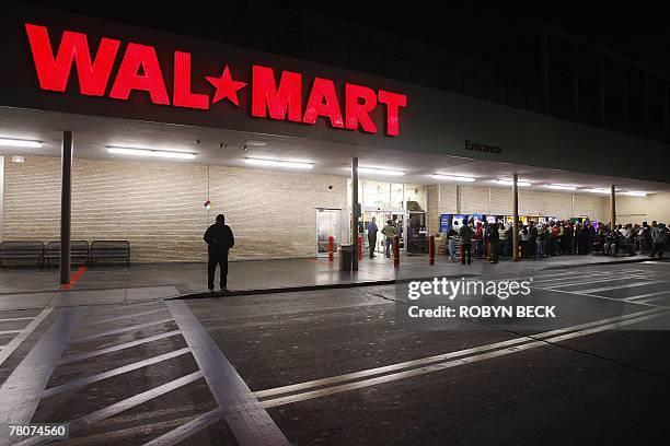 Early morning shoppers await the 5:00am opening of a Wal-Mart store, in Panorama City, California, 23 November 2007. The day after Thanksgiving,...