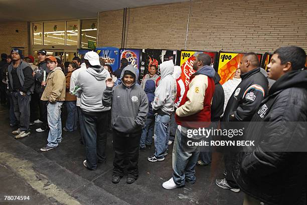 Early morning shoppers await the 5:00am opening of a Wal-Mart store, in Panorama City, California, 23 November 2007. The day after Thanksgiving,...