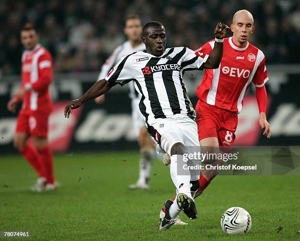 Stephan Sieger of Offenbach tackles Soumaila Coulibaly of Moenchengladbach during the 2nd Bundesliga match between Borussia Moenchengladbach and...