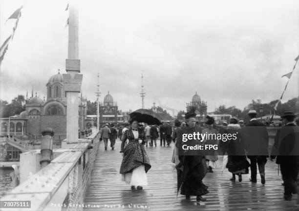 Visitors on the Pont de l'Alma, Paris, during the Exposition Universelle, 1900.