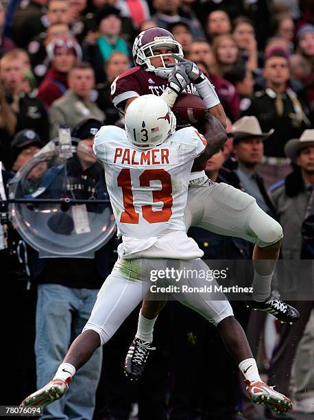 Wide receiver Kerry Franks of the Texas A&M Aggies makes a pass reception against Ryan Palmer of the Texas Longhorns at Kyle Field on November 23,...