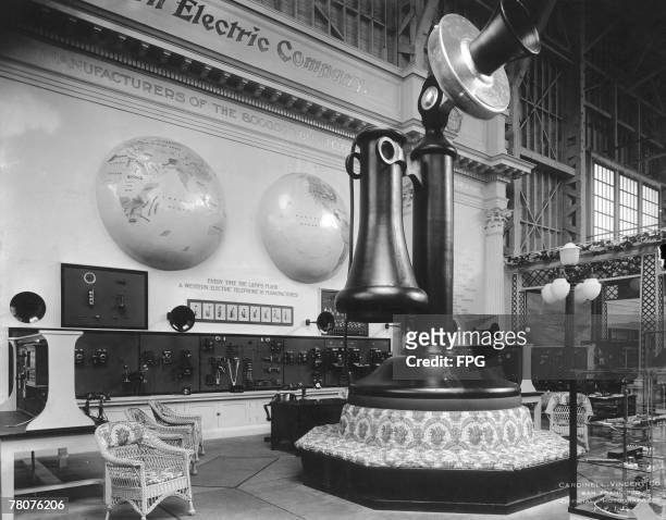 Giant model of a candlestick telephone, incorporating a sofa at its base, is the centrepiece of the Western Electric stand in the Palace of Liberal...