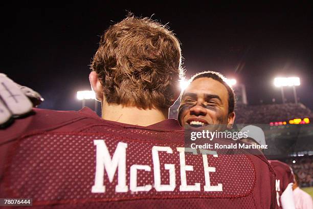 Wide receiver Earvin Taylor of the Texas A&M Aggies hugs Stephen McGee after a 38-30 win against the Texas Longhorns at Kyle Field November 23, 2007...