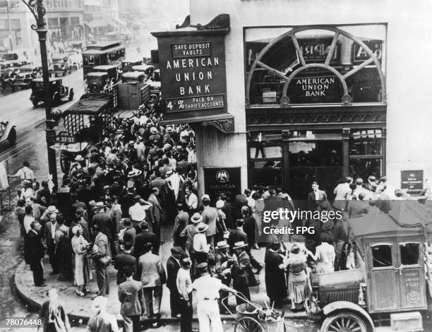 Crowd of depositors outside the American Union Bank in New York, having failed to withdraw their savings before the bank collapsed, 30th June 1931.